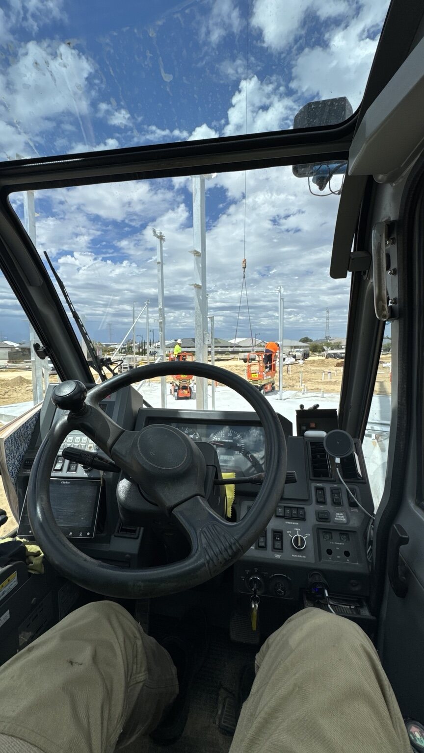 Operator view from inside the West Coast Crane Hire Tadano city crane cab